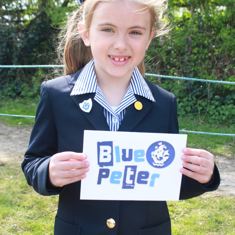 Image of I2 pupil, Iris, awarded the coveted Blue Peter Badge!