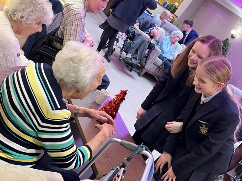 Image of  'Singing for Pleasure' pupils enjoy a delightful afternoon spreading festive cheer at The Moorings and Links View